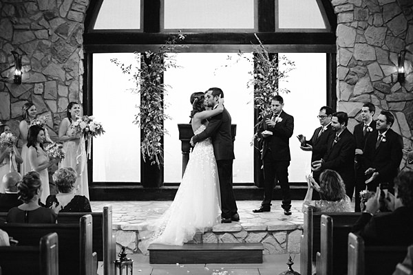 black and white wedding kiss