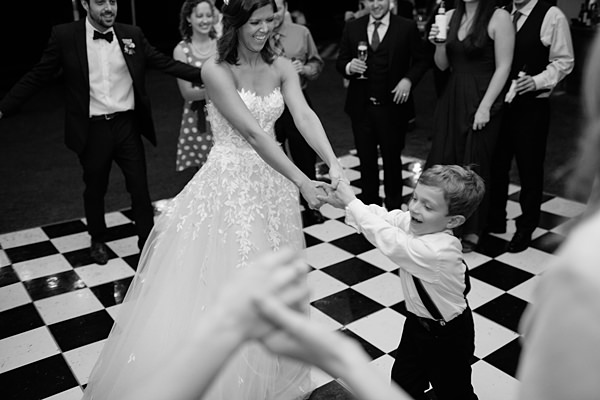 bride dancing with child