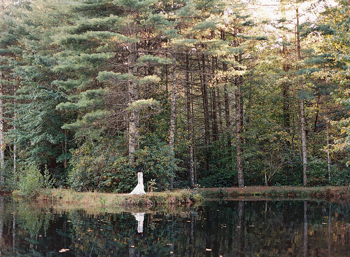 bride walking along pond